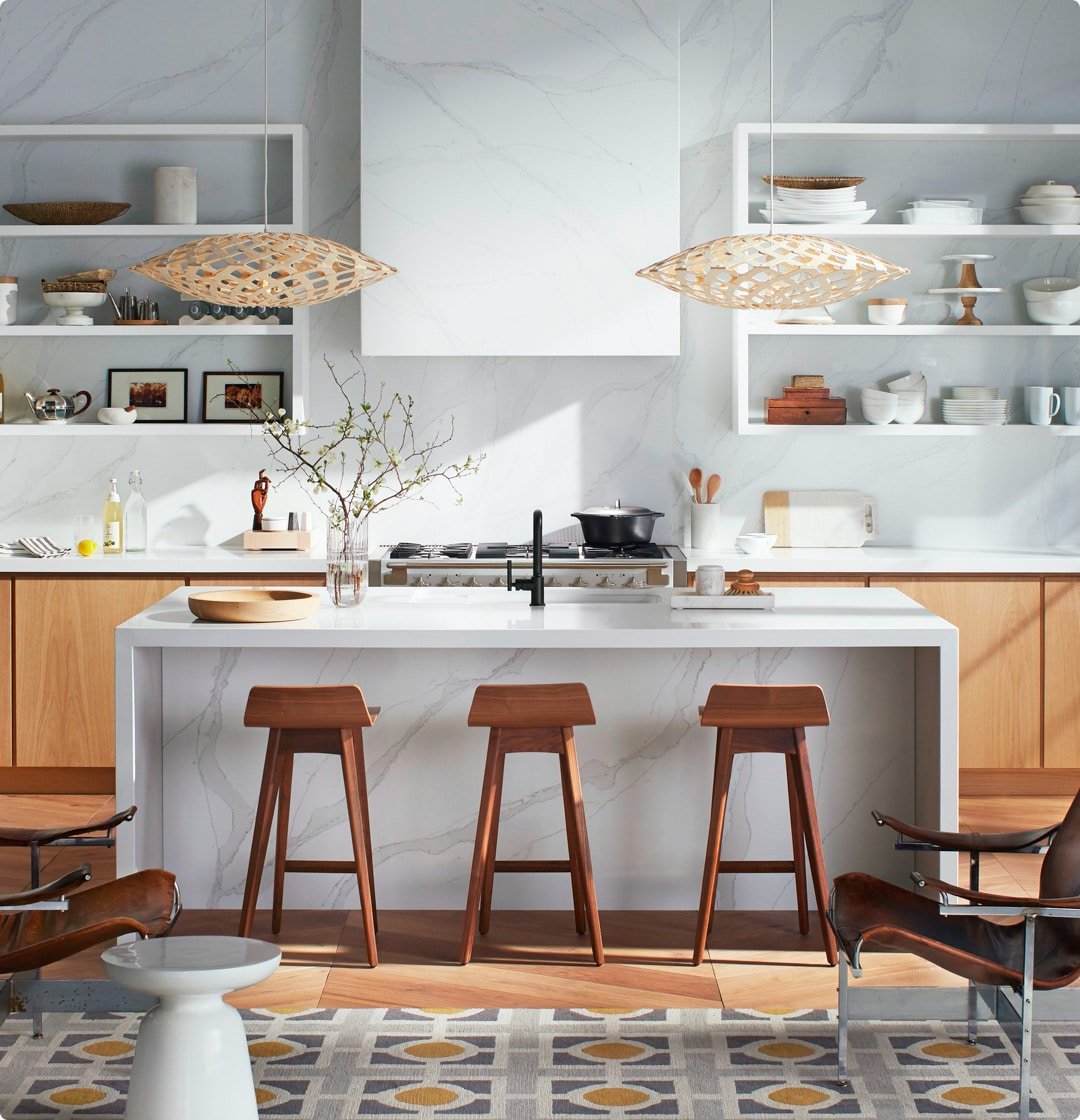 Silestone worktops in a modern kitchen setting with a white, marble-effect colour, paired with Silestone splashback and white wall cladding.