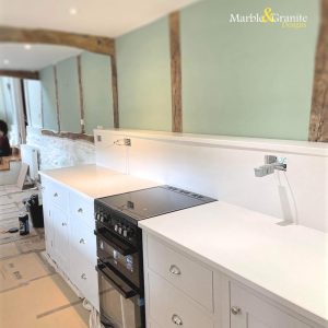 BQS Opus White Kitchen Worktops Installation by Marble and Granite Designs.