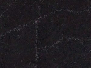 Pietra Modena BQS swatch. Fine-grained black quartz compound stone with fine white veins.