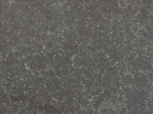 Stormy stone-effect quartz surface with a mid-to-dark grey background - Diresco Belgian Storm swatch