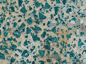 Breccia Emerald Swatch - beige base with emerald coloured irregular fragments.