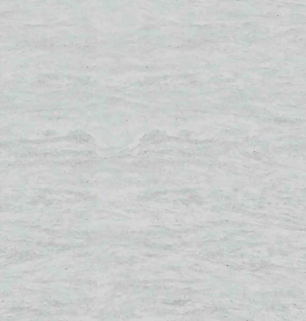 Fine-grained white-grey quartz compound stone with darker veins spread over the surface - Eramosa White Unistone