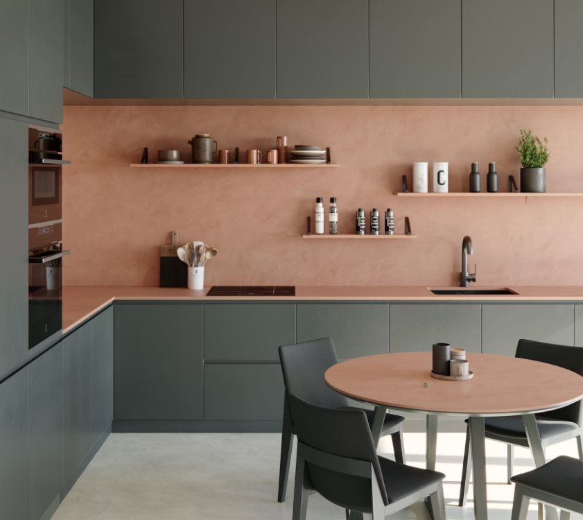 terracotta-coloured concrete-effect Dekton Umber wall cladding and kitchen worktop in a modern kitchen setting with dark grey cabinets.