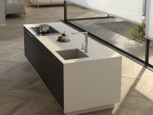 Miami Vena kitchen island in a modern kitchen with parquet flooring in medium oak finish. the island featured an integral sink, tap and hob and is clad all round in this white material.