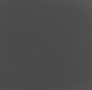 Fine-grained dark grey quartz compound stone with rounded paler fragments spread over the surface - Cemento Unistone swatch