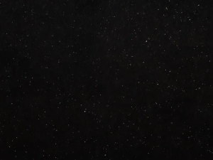 Fine-grained black quartz compound stone with shiny/reflecting grains spread over the surface - Nero Galactica Unistone swatch