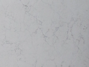 Fine-grained white quartz compound stone with vague darker grey veins spread over the surface - Valley White Unistone swatch