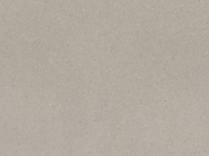 Fine-grained grey quartz compound stone with rounded paler fragments spread over the surface - Cendre Unistone swatch