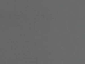 Fine-grained grey quartz compound stone with paler veins/structures spread over the surface - Uliano Unistone swatch