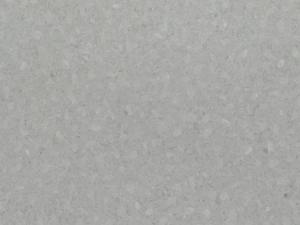 Fine-grained pale grey quartz compound stone with darker structures spread over the surface - Terreno Unistone swatch