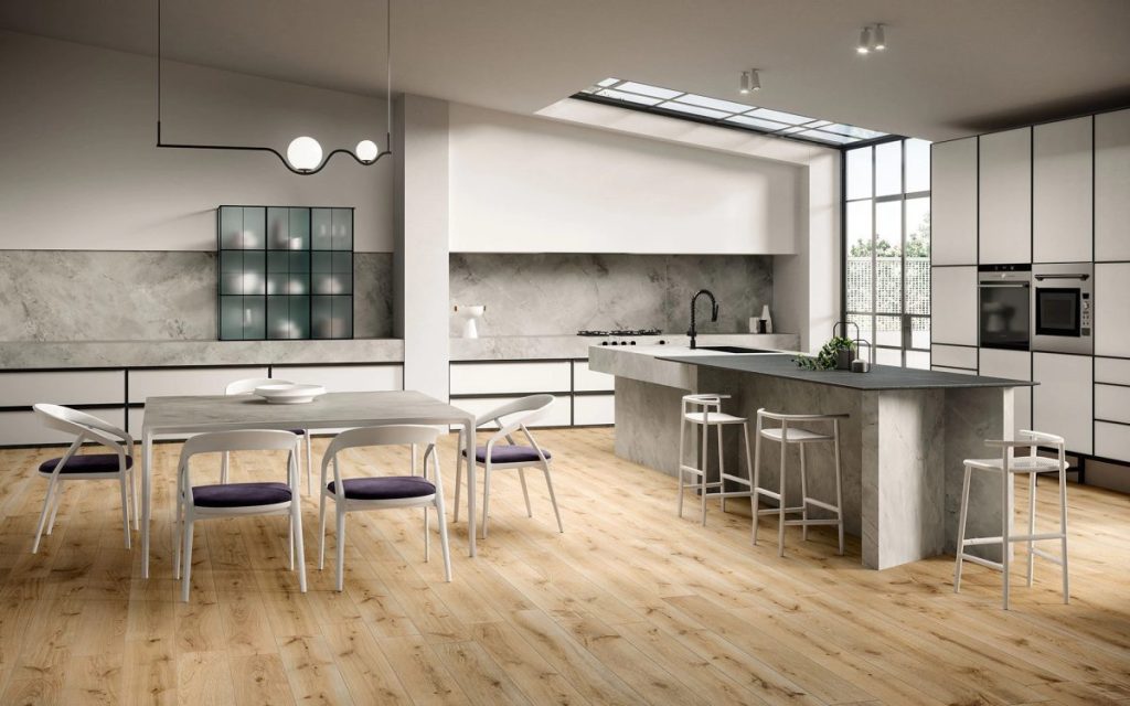 Atlas Plan porcelain stoneware being used as a kitchen worktop and dining table top in a modern kitchen setting.
