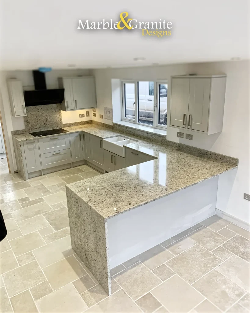 The full installation top-down view, showing mitred end panels, worksurfaces, upstands, sink and hob cutouts and splashback