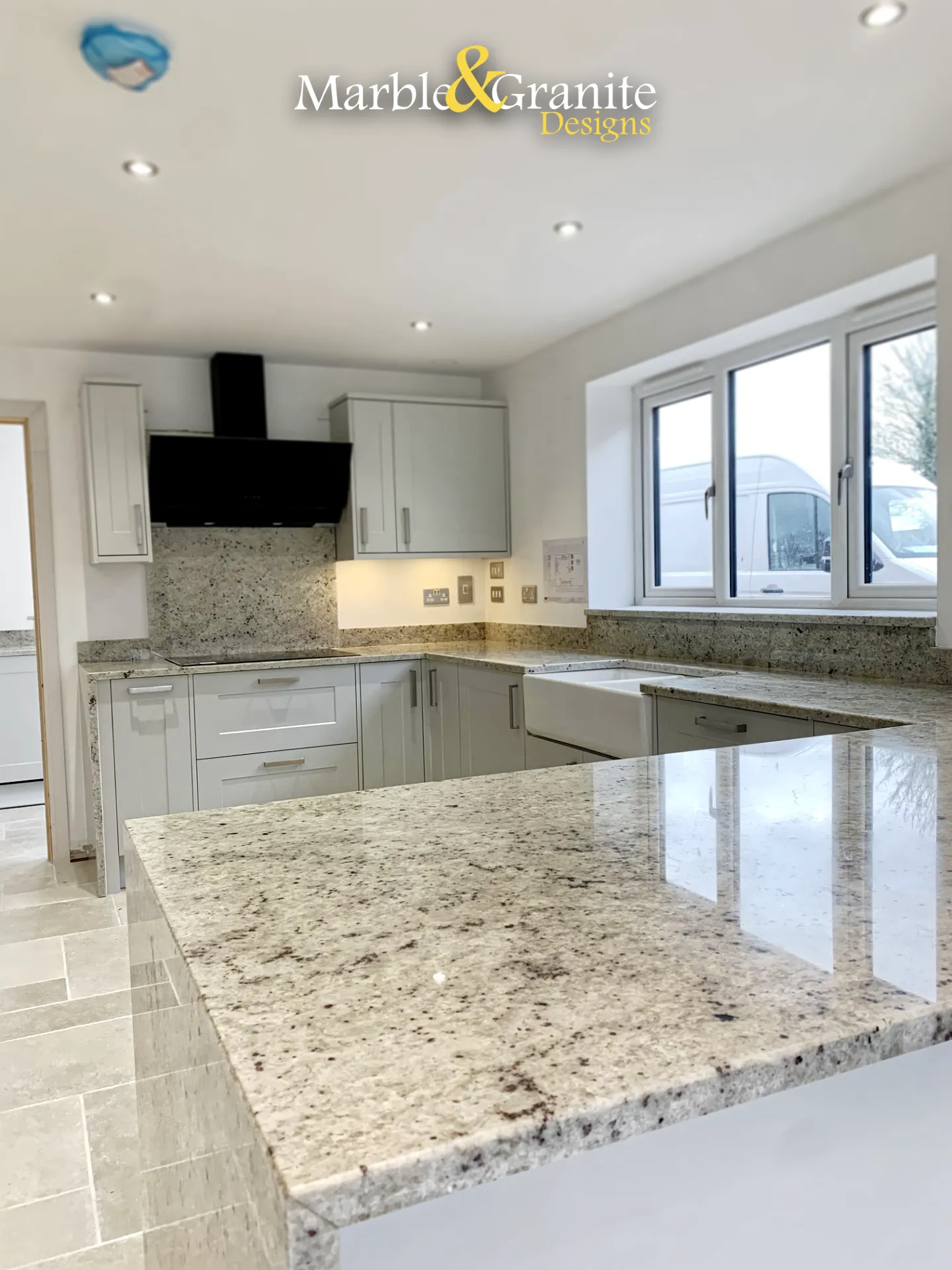 Close-up of the surface of the granite worktop in 30mm Colonial White granite
