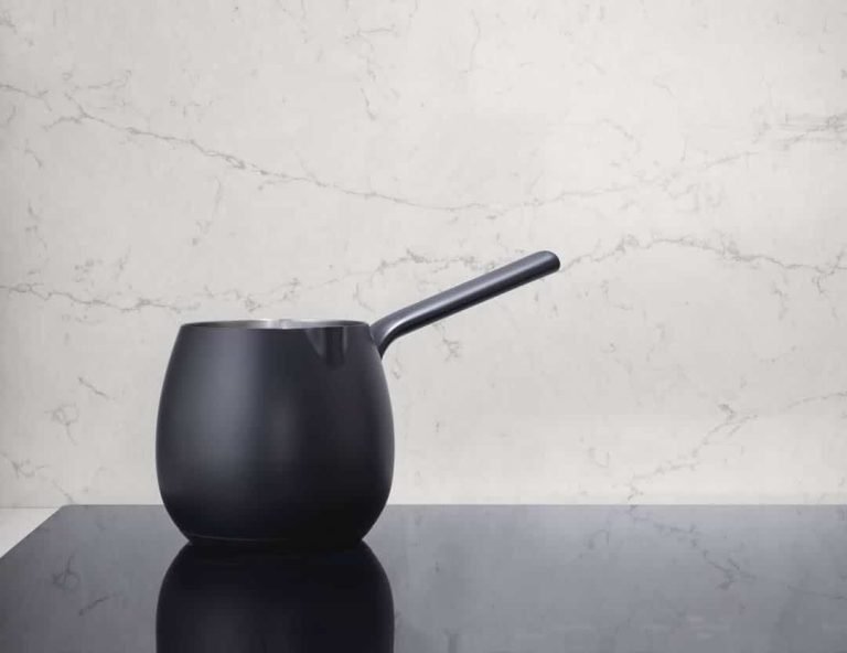 Silestone Wall Cladding and kitchen island in contrasting colours with Japanese-style teacup in black..