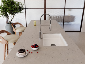 Silestone Concrete Pulse roomshot featuring japanese-style kitchen island with undermount sink in white and a chrome mixer tap.