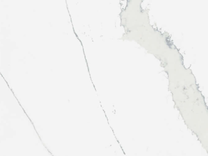 Fine-grained white quartz surface with marble-style veining running across the surface in a mix of thin and thick grey bands - Technistone Calacatta Pastino swatch