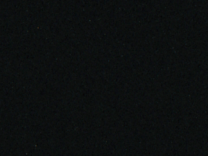 Granular black quartz surface with a plain polished appearance - Technistone Crystal Vulcano swatch