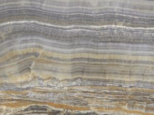 Product photo: Onice Grigio Marble is a sophisticated and luxurious natural stone, celebrated for its exquisite blend of grey tones and intricate veining. This marble features a stunning array of shades, from light silvery grays to deep charcoal, often accented with soft white or golden veins.