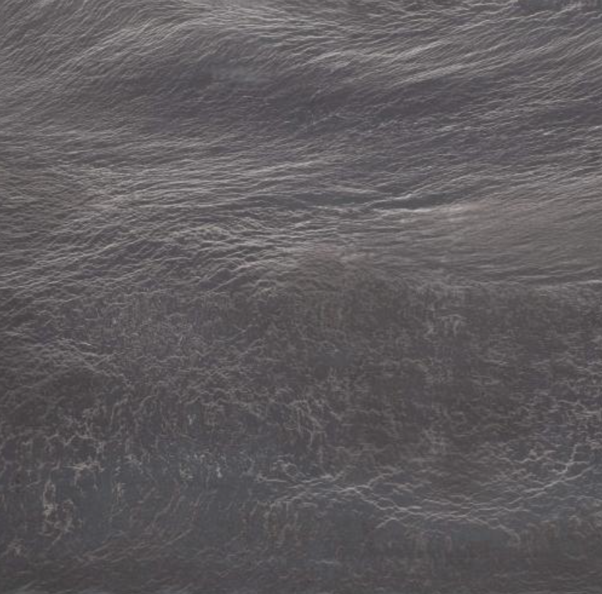 Product photo: Cinder Black Quartzite is a striking natural stone known for its deep, rich black colour accented by subtle, elegant veining. This unique blend of hues creates a sleek and modern aesthetic, perfect for adding a touch of sophistication to any space. The stone's luxurious appearance is reminiscent of a night sky, making it an ideal choice for those seeking a bold yet timeless look.