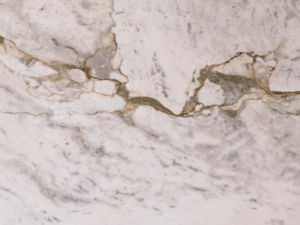 Product photo: Da Vinci Quartzite is a premium natural stone celebrated for its elegant appearance and exceptional durability. Named after the legendary artist Leonardo da Vinci, this quartzite embodies a timeless beauty that transforms interiors into sophisticated and luxurious spaces. The stone features a soft white background with intricate veining in shades of gold, grey, and subtle beige, creating a harmonious blend of colours that evoke a sense of refinement and artistry.