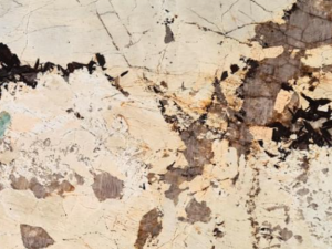 Product photo: Patagonia Quartzite is a breathtaking natural stone that captivates with its intricate and unique patterns. This quartzite is renowned for its dramatic appearance, featuring a complex blend of beige, grey, white, and black tones, often accented with hints of gold. The striking visual effect resembles a mosaic of natural elements, making each slab a one-of-a-kind masterpiece.