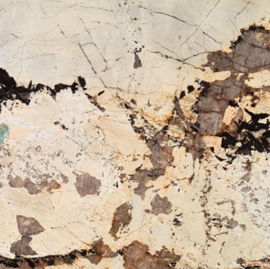 Product photo: Patagonia Quartzite is a breathtaking natural stone that captivates with its intricate and unique patterns. This quartzite is renowned for its dramatic appearance, featuring a complex blend of beige, grey, white, and black tones, often accented with hints of gold. The striking visual effect resembles a mosaic of natural elements, making each slab a one-of-a-kind masterpiece.