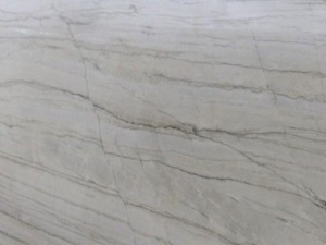 Product photo: White Macaubas Quartzite is a beautiful natural stone renowned for its refined and elegant appearance. This quartzite features a creamy white background accented with delicate, linear grey veining that creates a subtle and sophisticated pattern. The gentle contrast of colours makes White Macaubas an ideal choice for adding a touch of luxury to any space without overwhelming it.