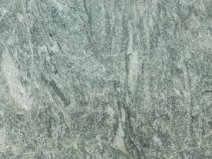 Product photo: Costa Smeralda Granite is a beautiful and sophisticated natural stone known for its unique blend of green and gray tones. Originating from the island of Sardinia in Italy, this granite features a soft and serene color palette, reminiscent of coastal landscapes and tranquil waters.