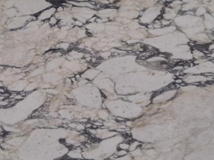 Product photo: Calacatta Viola Marble is an exceptional natural stone renowned for its luxurious and sophisticated appearance. This marble features a pristine white background that serves as a canvas for its distinctive and dramatic purple veining.