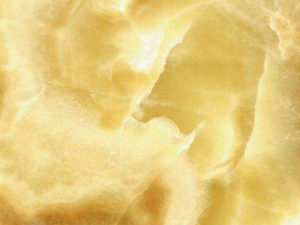 Product photo: Honey Onyx is a luxurious and visually captivating natural stone, renowned for its warm amber tones and intricate veining patterns. This unique stone, with its translucent quality, often features a beautiful array of colours ranging from deep honey and golden hues to lighter cream and beige tones. The striking veins and banding create a dynamic and mesmerizing visual effect, making it a standout choice for those looking to add a touch of opulence and elegance to their interior spaces.
